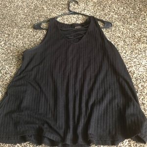 Sleeveless top with lace up top.